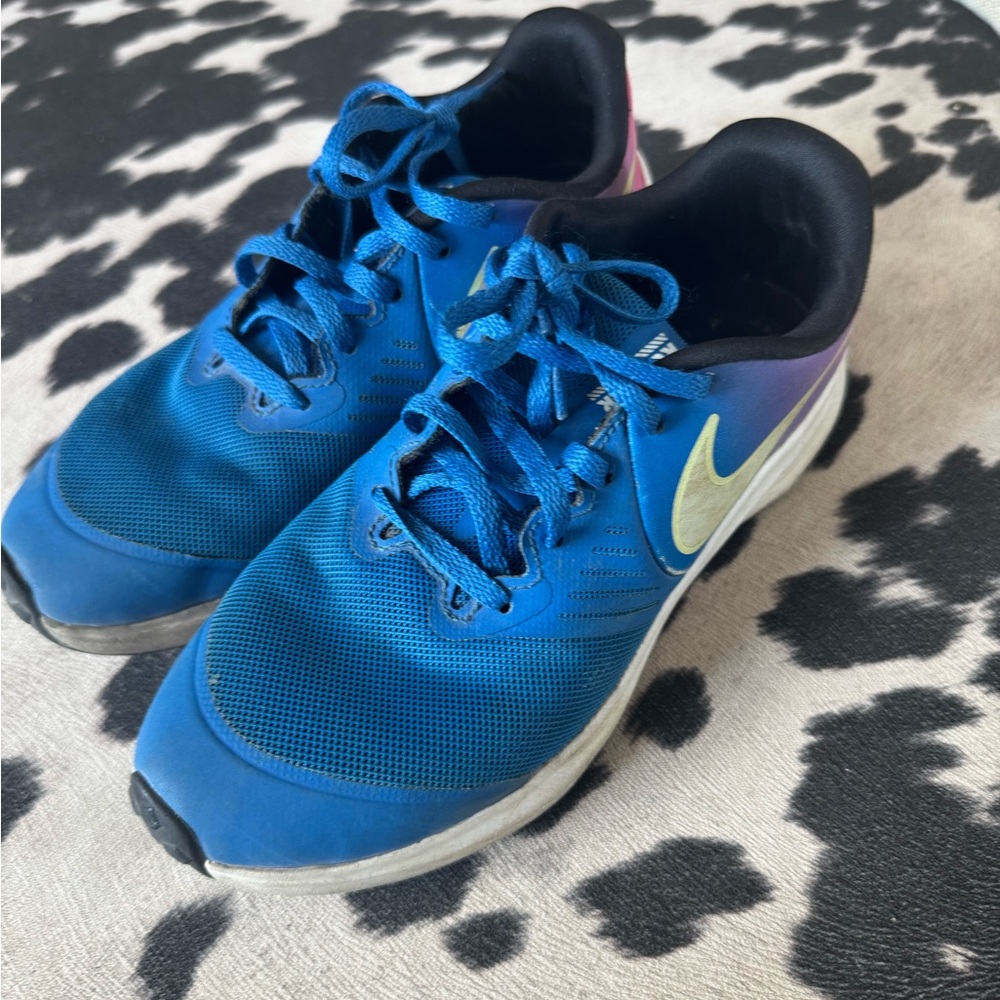 Blue and Purple Athletic Shoes with Nike Logo